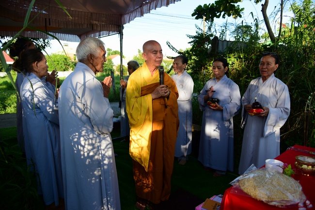 Liberating creatures at Binh My ferry and praying for peacefulness.