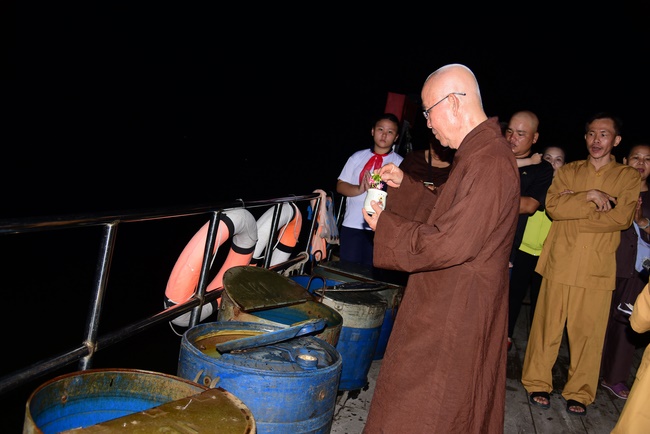 Liberating creatures at Binh My ferry and praying for peacefulness.