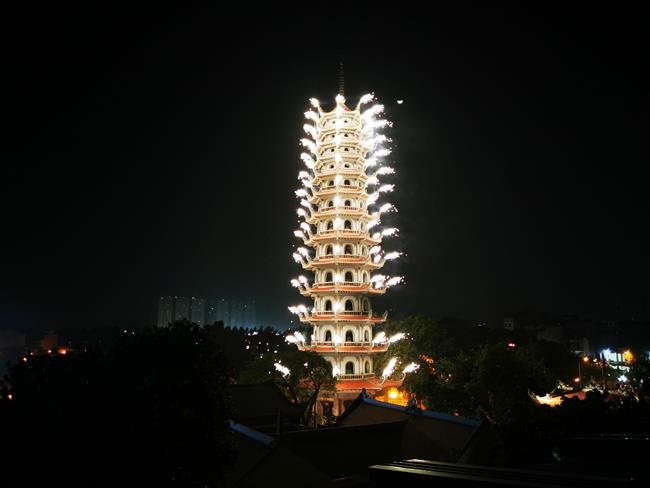 Attending the floral candle light ceremony on the Shakyamuni Buddha's Attainment Day at Bang Pagoda - Ha Noi