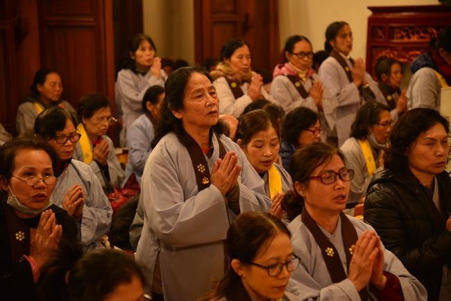 Attending the floral candle light ceremony on the Shakyamuni Buddha's Attainment Day at Bang Pagoda - Ha Noi