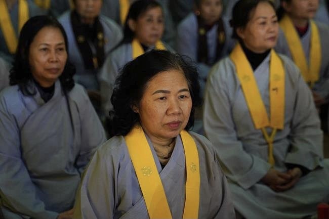 Attending the floral candle light ceremony on the Shakyamuni Buddha's Attainment Day at Bang Pagoda - Ha Noi
