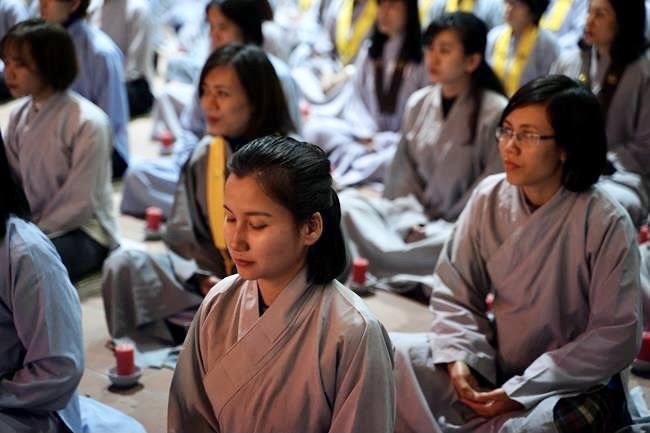 Attending the floral candle light ceremony on the Shakyamuni Buddha's Attainment Day at Bang Pagoda - Ha Noi