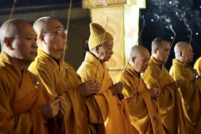 Attending the floral candle light ceremony on the Shakyamuni Buddha's Attainment Day at Bang Pagoda - Ha Noi