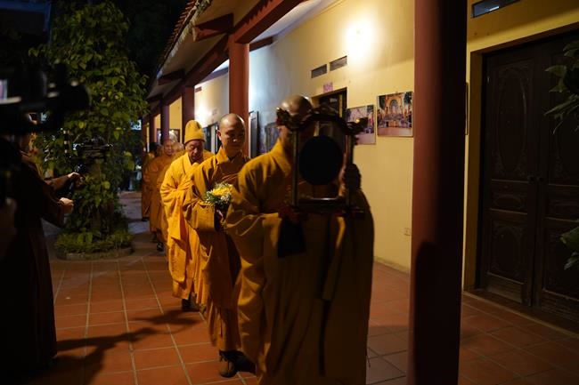 Attending the floral candle light ceremony on the Shakyamuni Buddha's Attainment Day at Bang Pagoda - Ha Noi