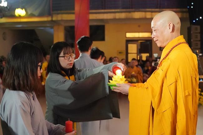 Attending the floral candle light ceremony on the Shakyamuni Buddha's Attainment Day at Bang Pagoda - Ha Noi