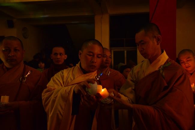 Attending the floral candle light ceremony on the Shakyamuni Buddha's Attainment Day at Bang Pagoda - Ha Noi