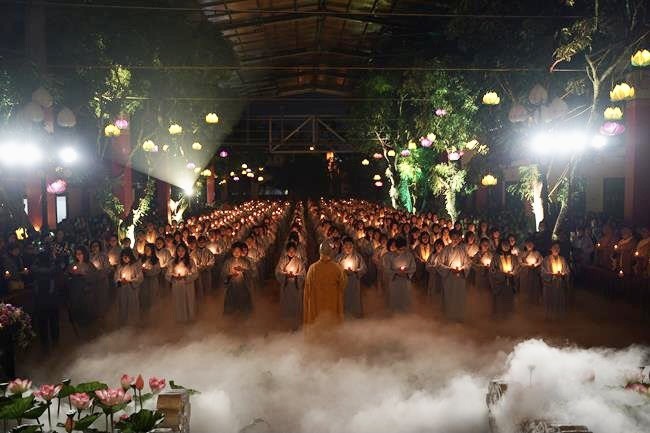 Attending the floral candle light ceremony on the Shakyamuni Buddha's Attainment Day at Bang Pagoda - Ha Noi