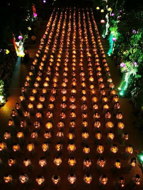 Attending the floral candle light ceremony on the Shakyamuni Buddha's Attainment Day at Bang Pagoda - Ha Noi