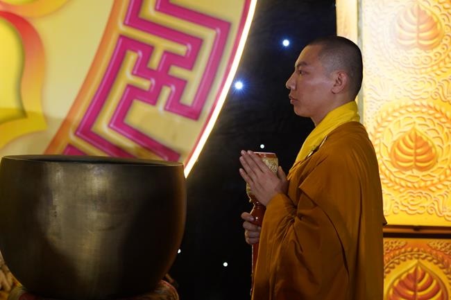 Attending the floral candle light ceremony on the Shakyamuni Buddha's Attainment Day at Bang Pagoda - Ha Noi
