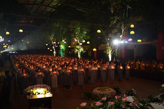 Attending the floral candle light ceremony on the Shakyamuni Buddha's Attainment Day at Bang Pagoda - Ha Noi