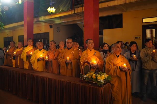 Attending the floral candle light ceremony on the Shakyamuni Buddha's Attainment Day at Bang Pagoda - Ha Noi