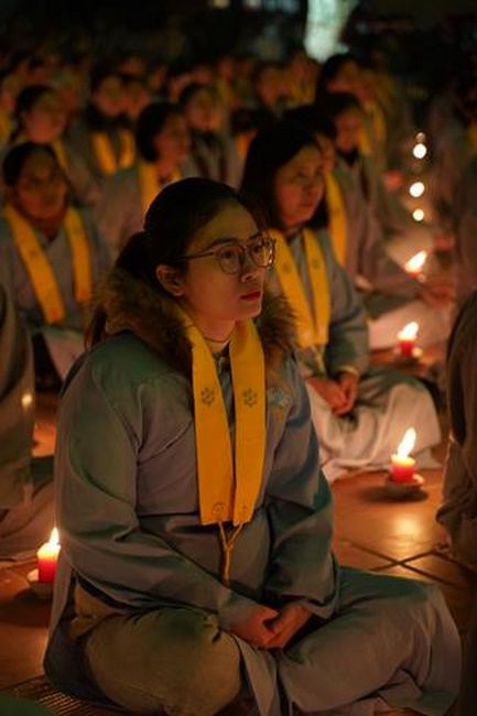 Attending the floral candle light ceremony on the Shakyamuni Buddha's Attainment Day at Bang Pagoda - Ha Noi
