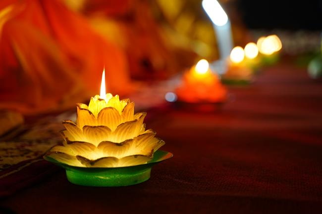 Attending the floral candle light ceremony on the Shakyamuni Buddha's Attainment Day at Bang Pagoda - Ha Noi