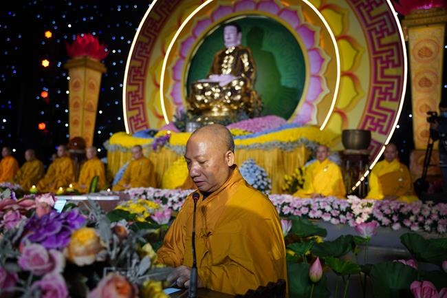 Attending the floral candle light ceremony on the Shakyamuni Buddha's Attainment Day at Bang Pagoda - Ha Noi