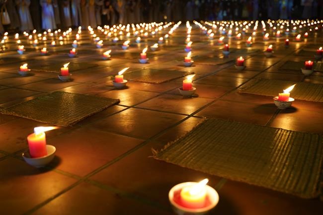 Attending the floral candle light ceremony on the Shakyamuni Buddha's Attainment Day at Bang Pagoda - Ha Noi