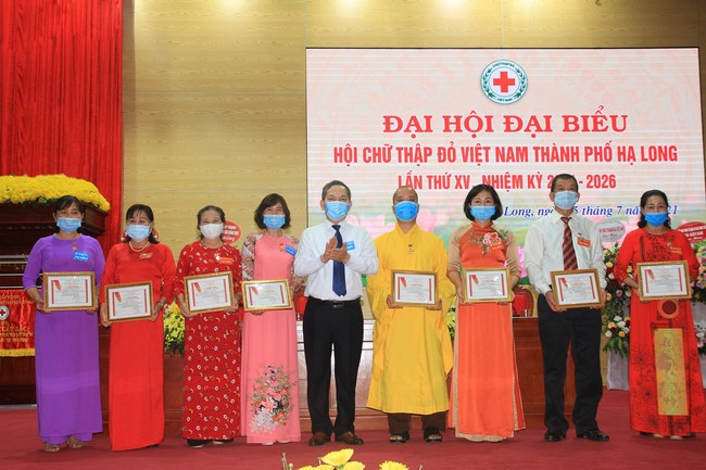 Tieu Dao pagoda: Junior Thich Tam Tinh receiving a Campaign Medal from Vietnam Red Cross