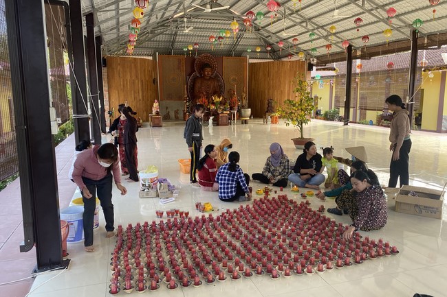 Beginning a sutra in the New Year at Suoi Phap Pagoda, Tay Ninh