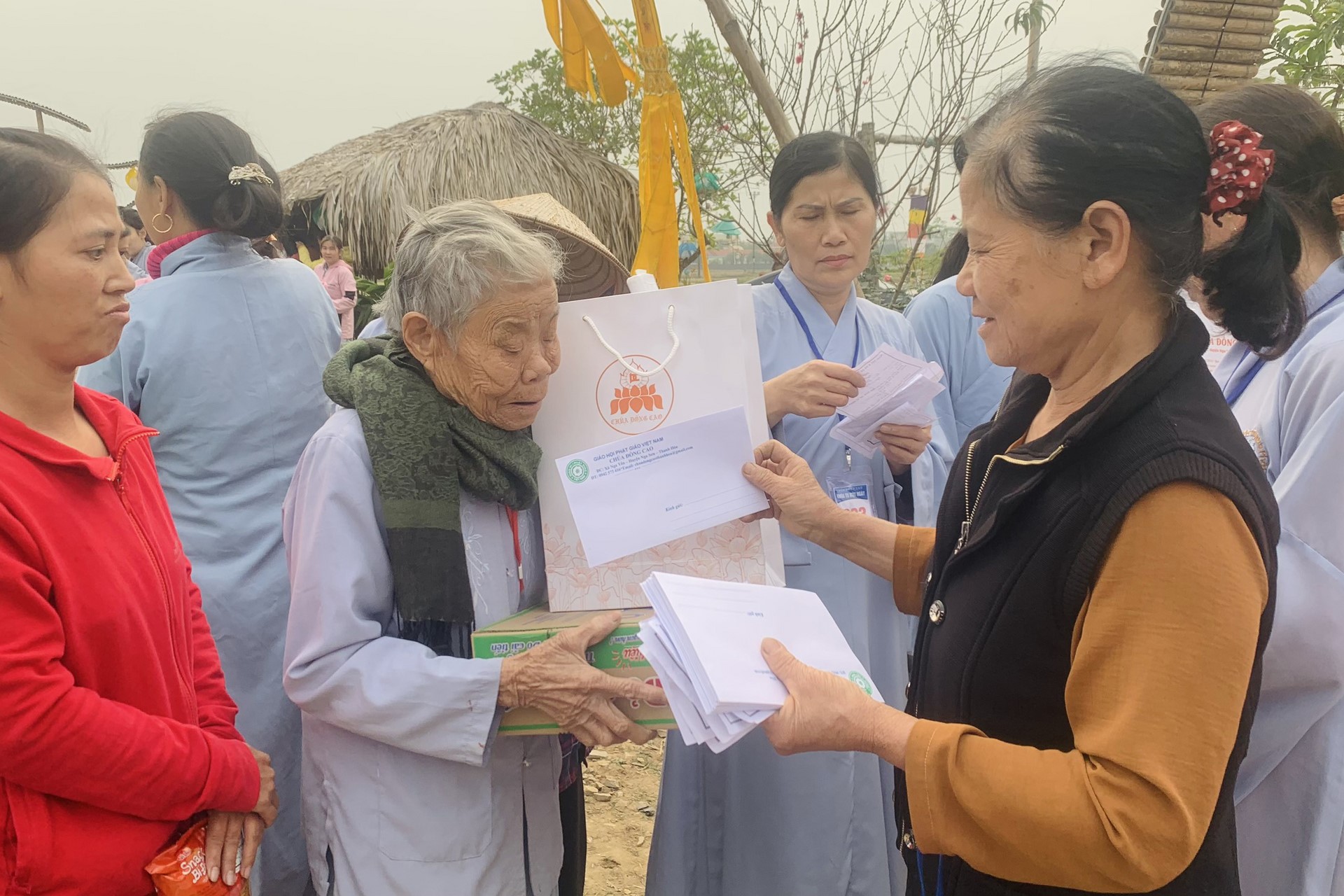 Year End Retreat, a past year closing rite, giving Tet gifts at Dong Cao pagoda