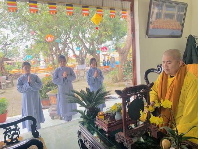 Year End Practice, a past year closing program, giving Tet gifts at Dong Cao pagoda