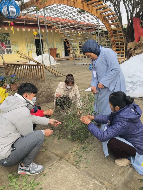 Year End Practice, a past year closing program, giving Tet gifts at Dong Cao pagoda