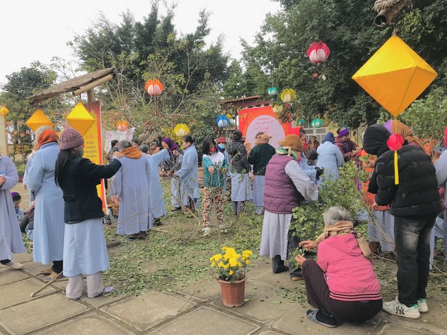Year End Practice, a past year closing program, giving Tet gifts at Dong Cao pagoda