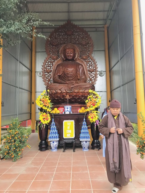 Year End Practice, a past year closing program, giving Tet gifts at Dong Cao pagoda