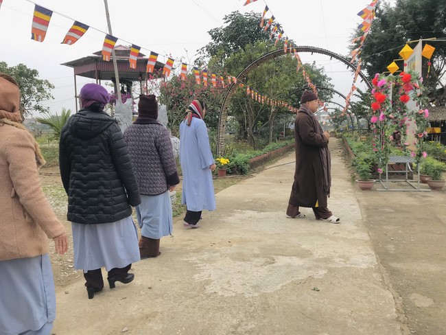 Year End Practice, a past year closing program, giving Tet gifts at Dong Cao pagoda