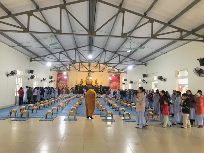 Year End Practice, a past year closing program, giving Tet gifts at Dong Cao pagoda