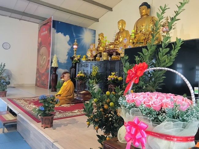 Year End Practice, a past year closing program, giving Tet gifts at Dong Cao pagoda