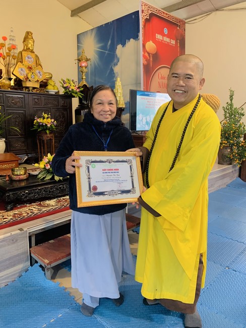 Year End Practice, a past year closing program, giving Tet gifts at Dong Cao pagoda