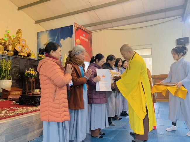 Year End Practice, a past year closing program, giving Tet gifts at Dong Cao pagoda