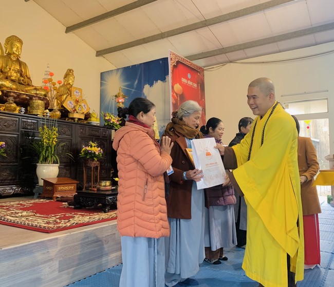 Year End Practice, a past year closing program, giving Tet gifts at Dong Cao pagoda