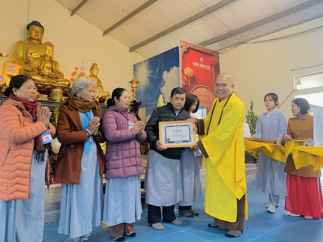 Year End Practice, a past year closing program, giving Tet gifts at Dong Cao pagoda