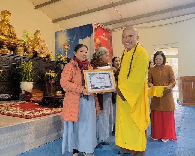 Year End Practice, a past year closing program, giving Tet gifts at Dong Cao pagoda