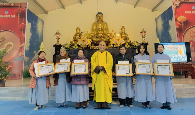 Year End Practice, a past year closing program, giving Tet gifts at Dong Cao pagoda