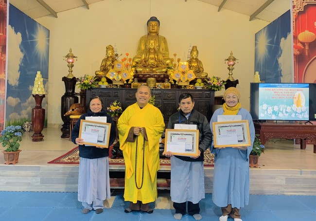 Year End Practice, a past year closing program, giving Tet gifts at Dong Cao pagoda