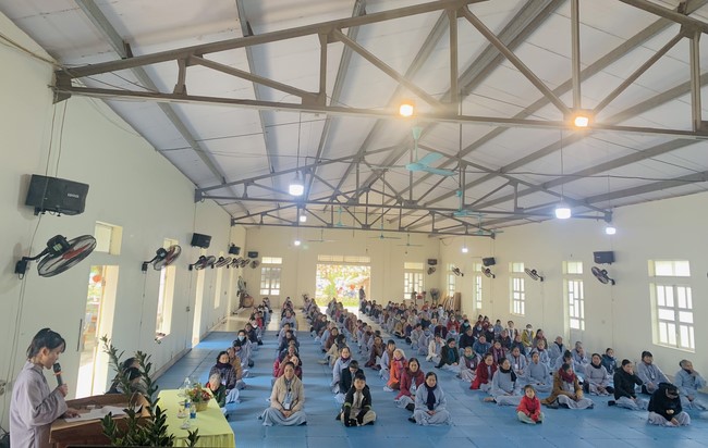 Year End Practice, a past year closing program, giving Tet gifts at Dong Cao pagoda