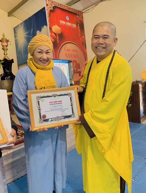 Year End Practice, a past year closing program, giving Tet gifts at Dong Cao pagoda