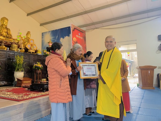 Year End Practice, a past year closing program, giving Tet gifts at Dong Cao pagoda