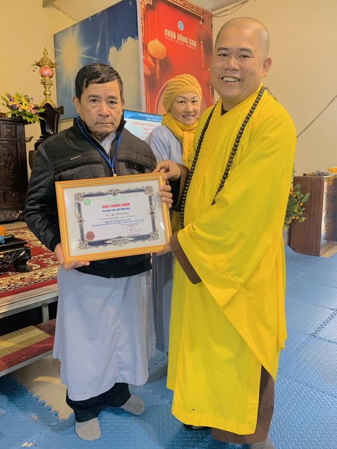 Year End Practice, a past year closing program, giving Tet gifts at Dong Cao pagoda