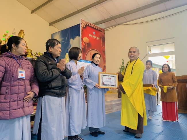 Year End Practice, a past year closing program, giving Tet gifts at Dong Cao pagoda