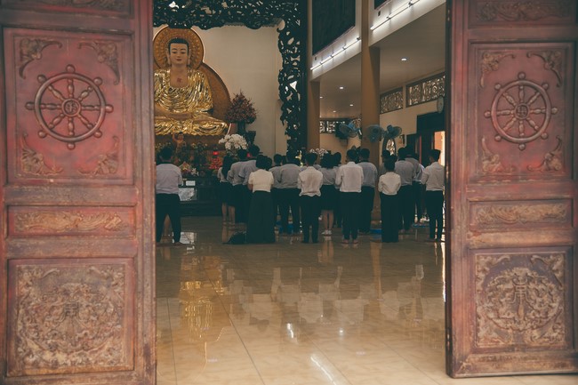 Nhan Van School students praying before the University Examination