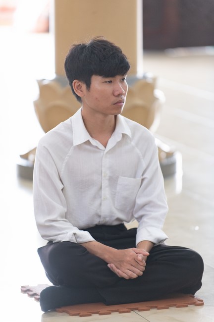 Nhan Van School students praying before the University Examination