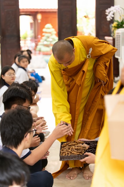 Nhan Van School students praying before the University Examination