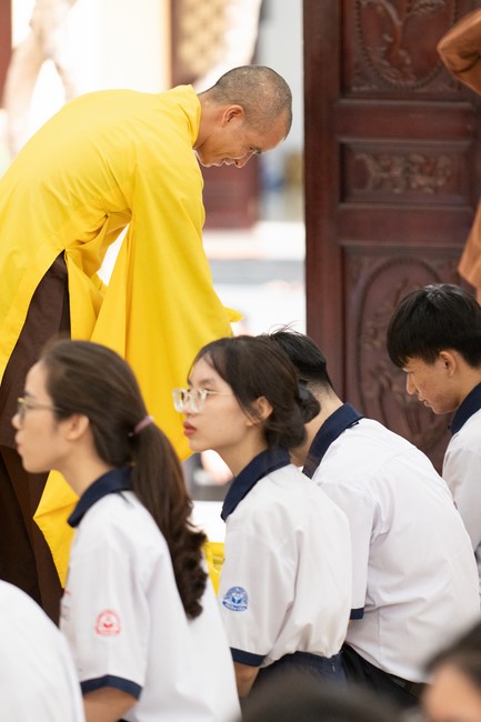 Nhan Van School students praying before the University Examination