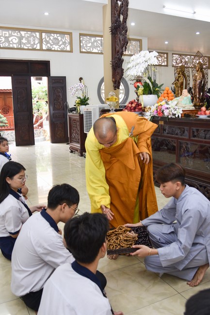 Nhan Van School students praying before the University Examination