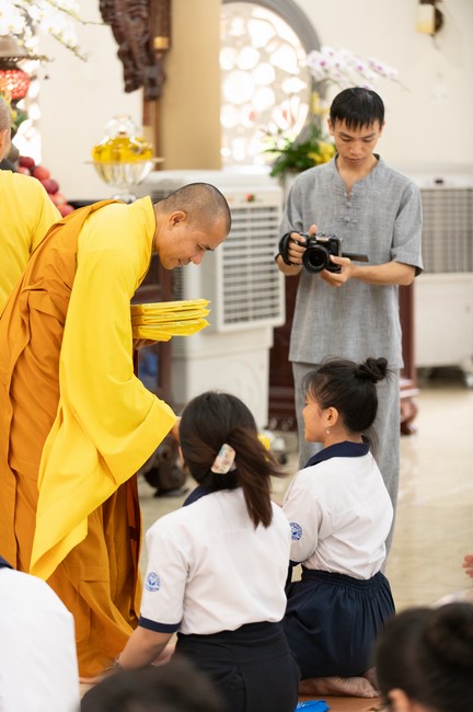 Nhan Van School students praying before the University Examination
