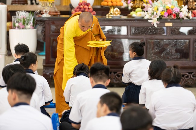 Nhan Van School students praying before the University Examination