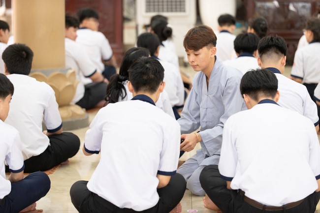 Nhan Van School students praying before the University Examination