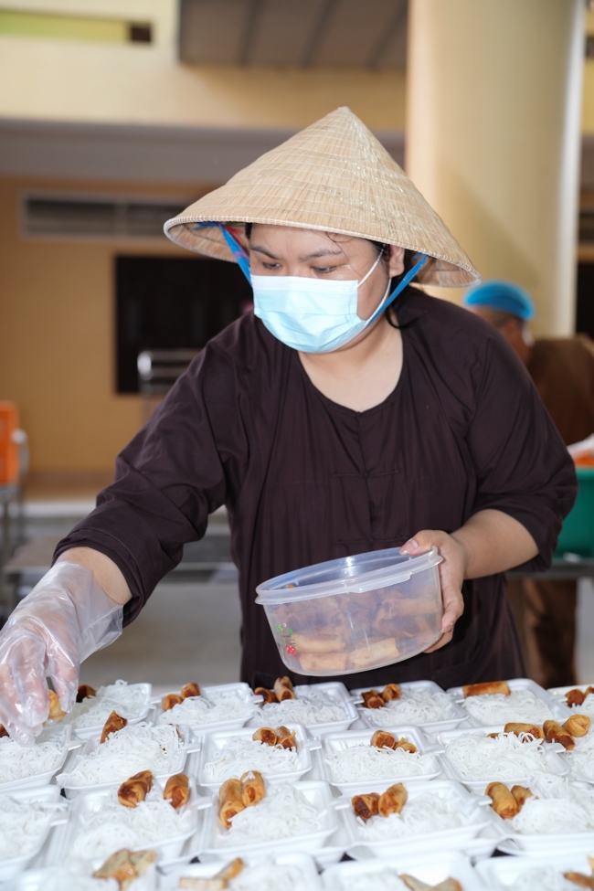 Giving vegetarian vermicelli at Thanh Loc  Paralytic Supporting and Nurturing Center in the Temple's Charity Activities